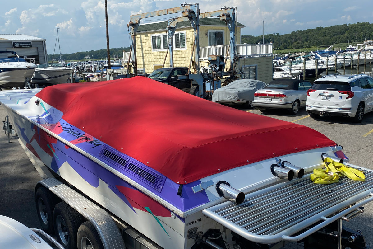 Red canvas cockpit cover on a powerboat